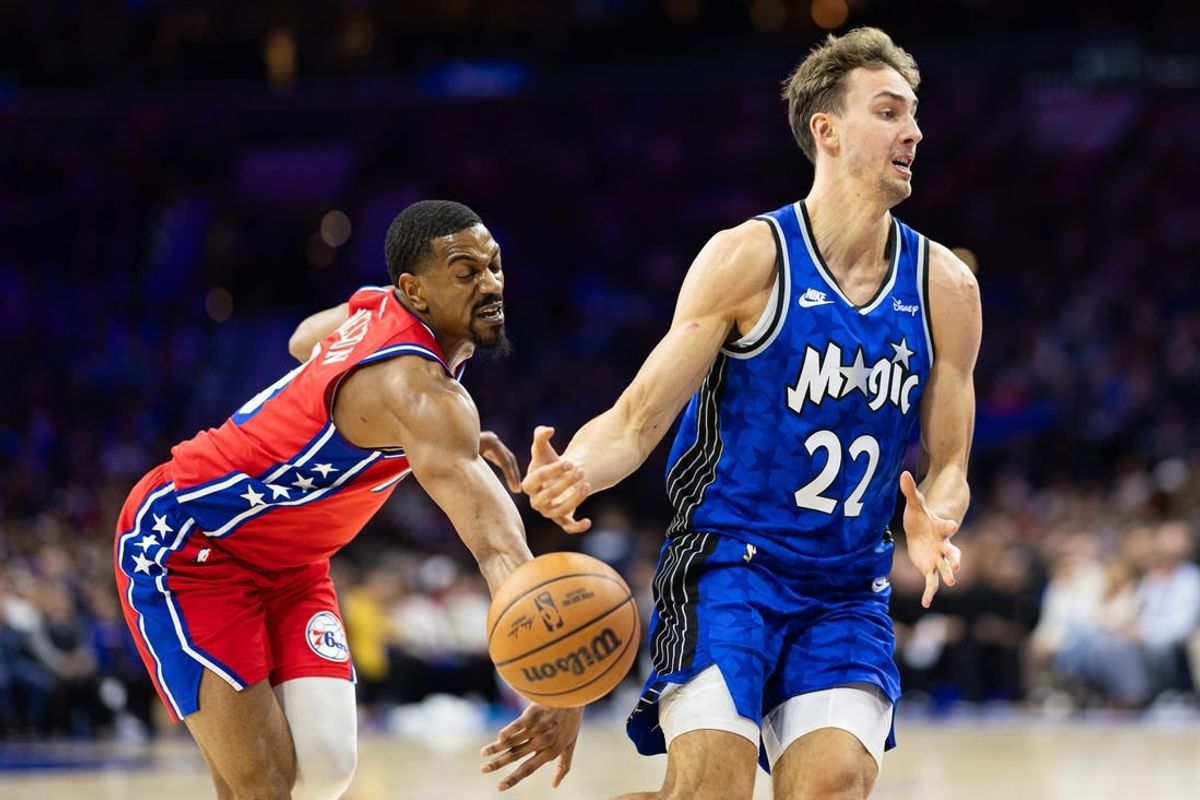 Apr 12, 2024; Philadelphia, Pennsylvania, USA; Philadelphia 76ers guard De'Anthony Melton (8) knocks the ball away from Orlando Magic forward Franz Wagner (22) during the second quarter at Wells Fargo Center.