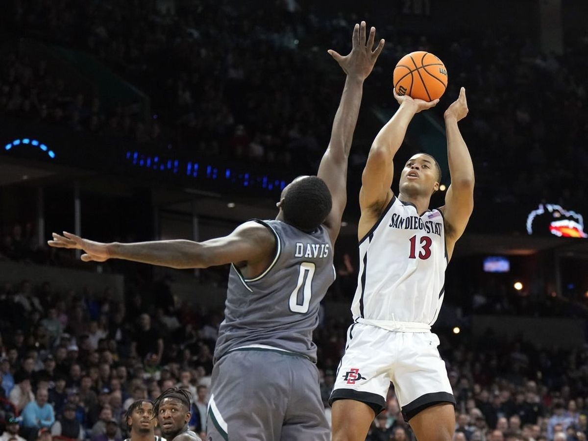 Mar 22, 2024; Spokane, WA, USA; San Diego State Aztecs forward Jaedon LeDee (13) attempts a basket against UAB Blazers forward Javian Davis (0) during the second half in the first round of the 2024 NCAA Tournament at Spokane Veterans Memorial Arena.