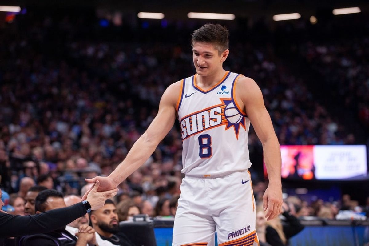 Apr 12, 2024; Sacramento, California, USA; Phoenix Suns guard Grayson Allen (8) high fives coaches as he comes out of the game during the second quarter at Golden 1 Center.