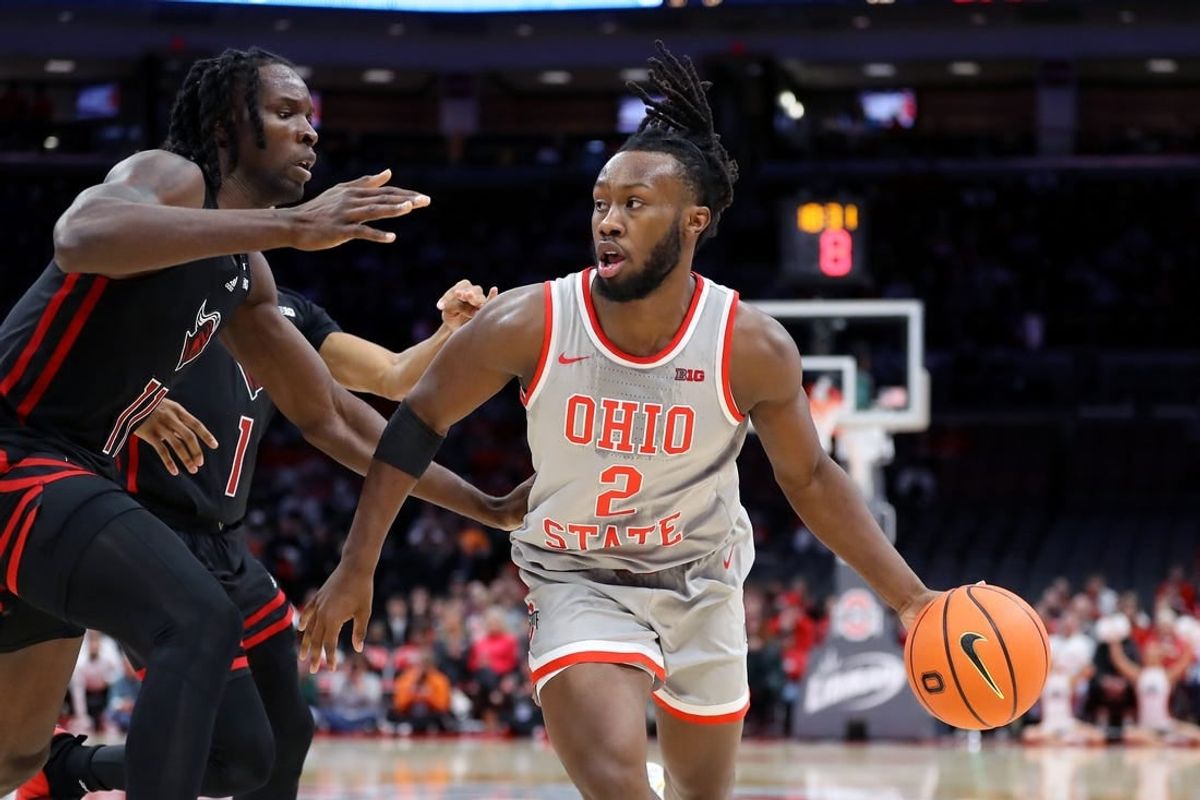 Jan 3, 2024; Columbus, Ohio, USA; Ohio State Buckeyes guard Bruce Thornton (2) dribbles the ball as Rutgers Scarlet Knights center Clifford Omoruyi (11) defends during the second half at Value City Arena.