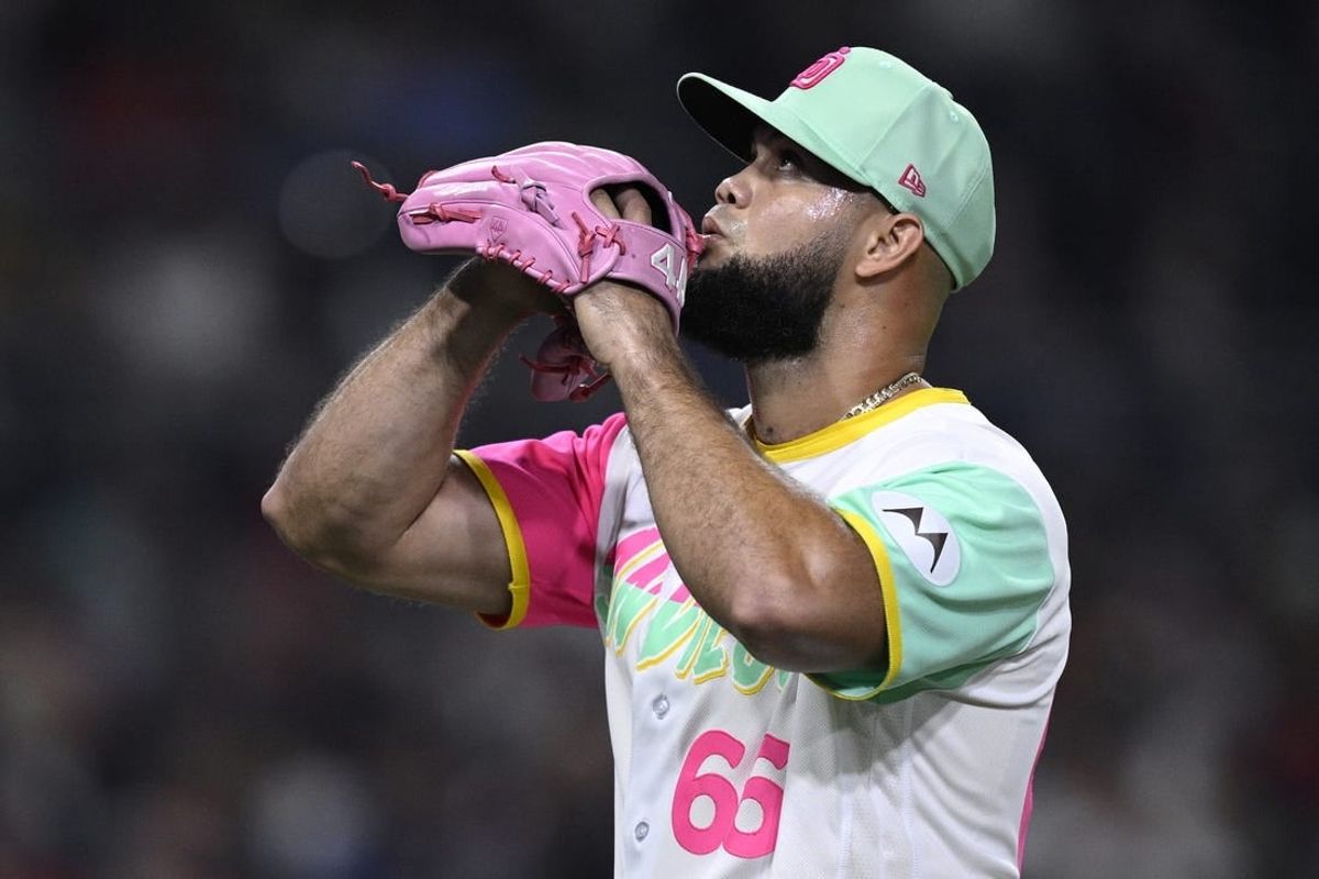 Sep 22, 2023; San Diego, California, USA; San Diego Padres relief pitcher Luis Garcia (66) reacts while walking to the dugout after a pitching change in the eighth inning against the St. Louis Cardinals at Petco Park.