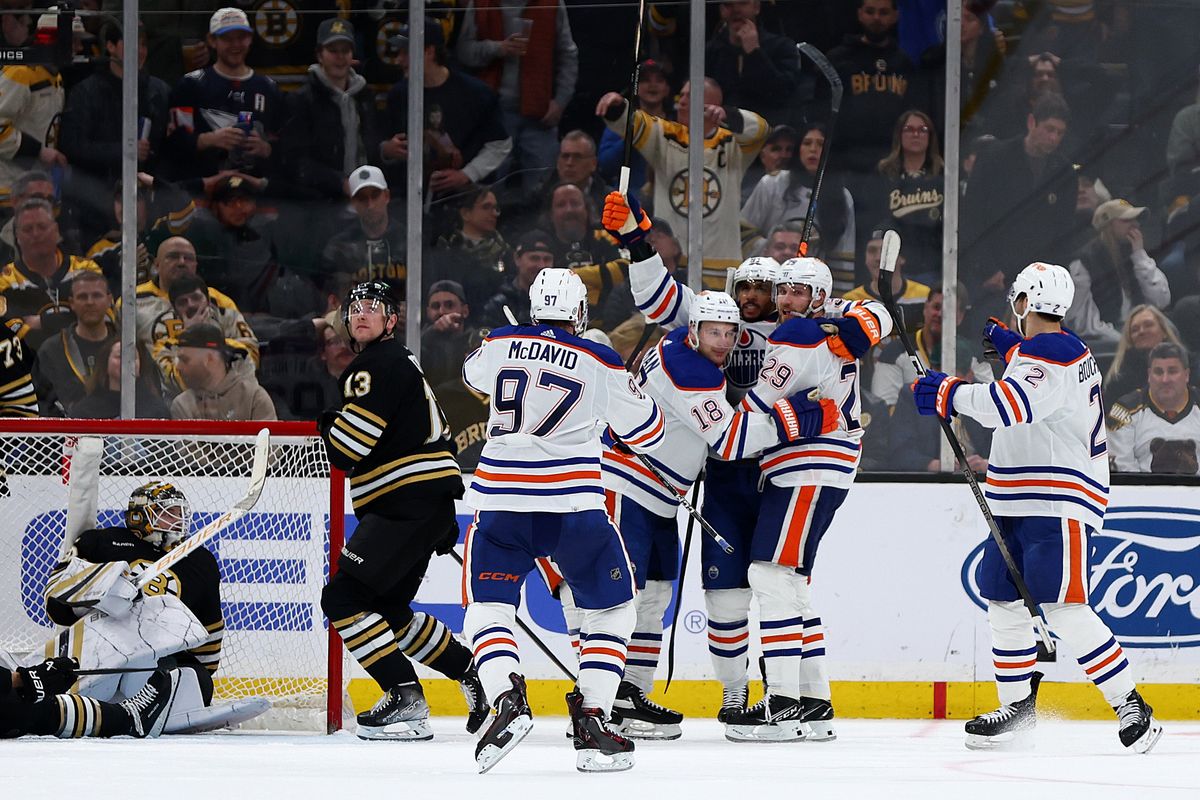 BOSTON, MASSACHUSETTS - MARCH 05: Leon Draisaitl #29 of the Edmonton Oilers celebrates with Connor McDavid #97, Ryan Nugent-Hopkins #93, Evan Bouchard #2, and Evander Kane #91 after scoring against Linus Ullmark #35 of the Boston Bruins as Charlie Coyle #13 looks on during the third period at TD Garden on March 05, 2024 in Boston, Massachusetts. The Oilers defeat the Bruins 2-1 in overtime.  (Photo by Maddie Meyer/Getty Images)