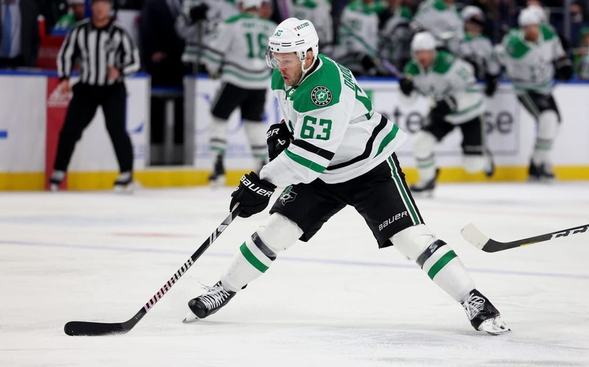 Feb 6, 2024; Buffalo, New York, USA;  Dallas Stars right wing Evgenii Dadonov (63) skates with the puck during the third period against the Buffalo Sabres at KeyBank Center.