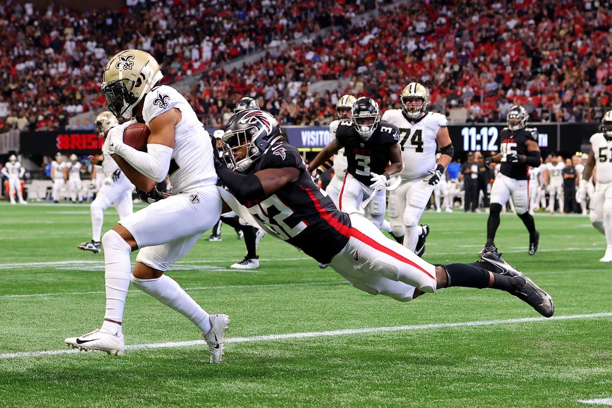 The Saints’ Chris Olave pulls down a two-point  conversion pass against the Falcons’ Jaylinn Hawkins