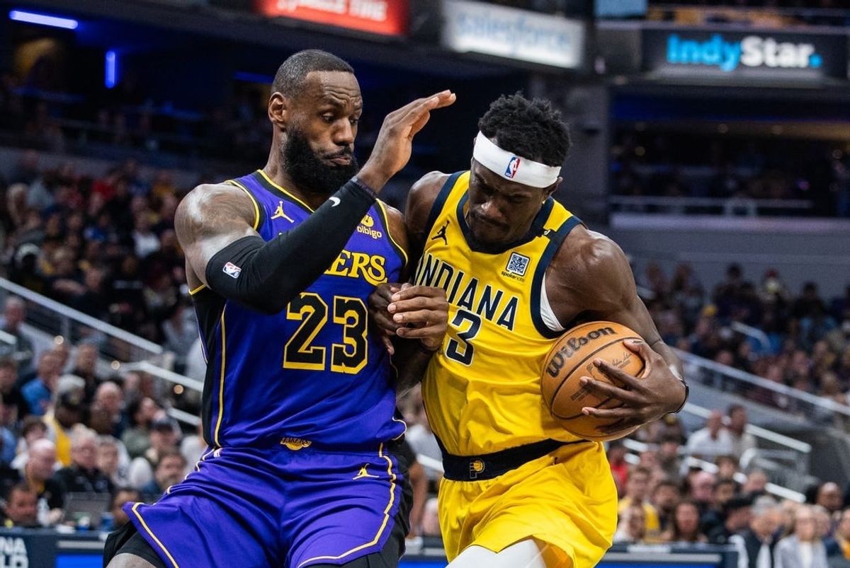 Mar 29, 2024; Indianapolis, Indiana, USA; Indiana Pacers forward Pascal Siakam (43) shoots the ball while Los Angeles Lakers forward LeBron James (23) defends in the first half at Gainbridge Fieldhouse.