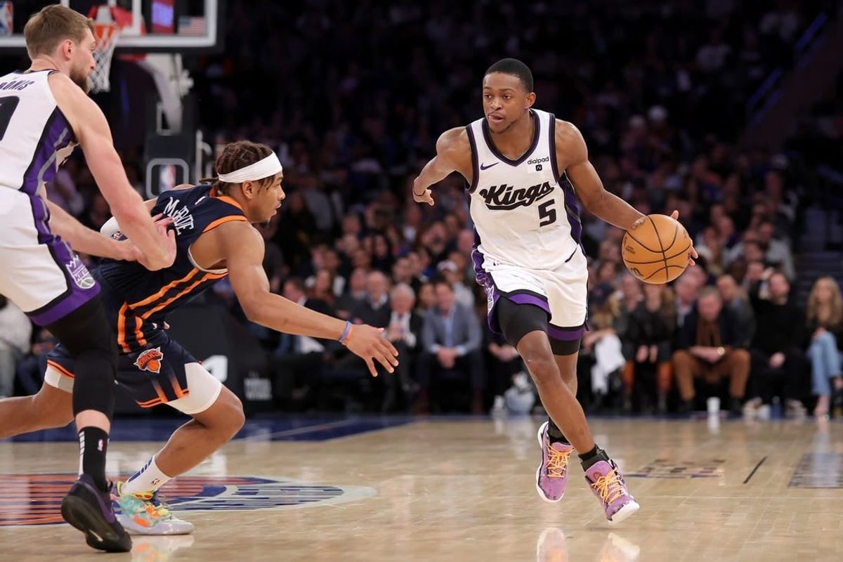 Apr 4, 2024; New York, New York, USA; Sacramento Kings guard De'Aaron Fox (5) handles the ball against New York Knicks guard Miles McBride (2) during the fourth quarter at Madison Square Garden.