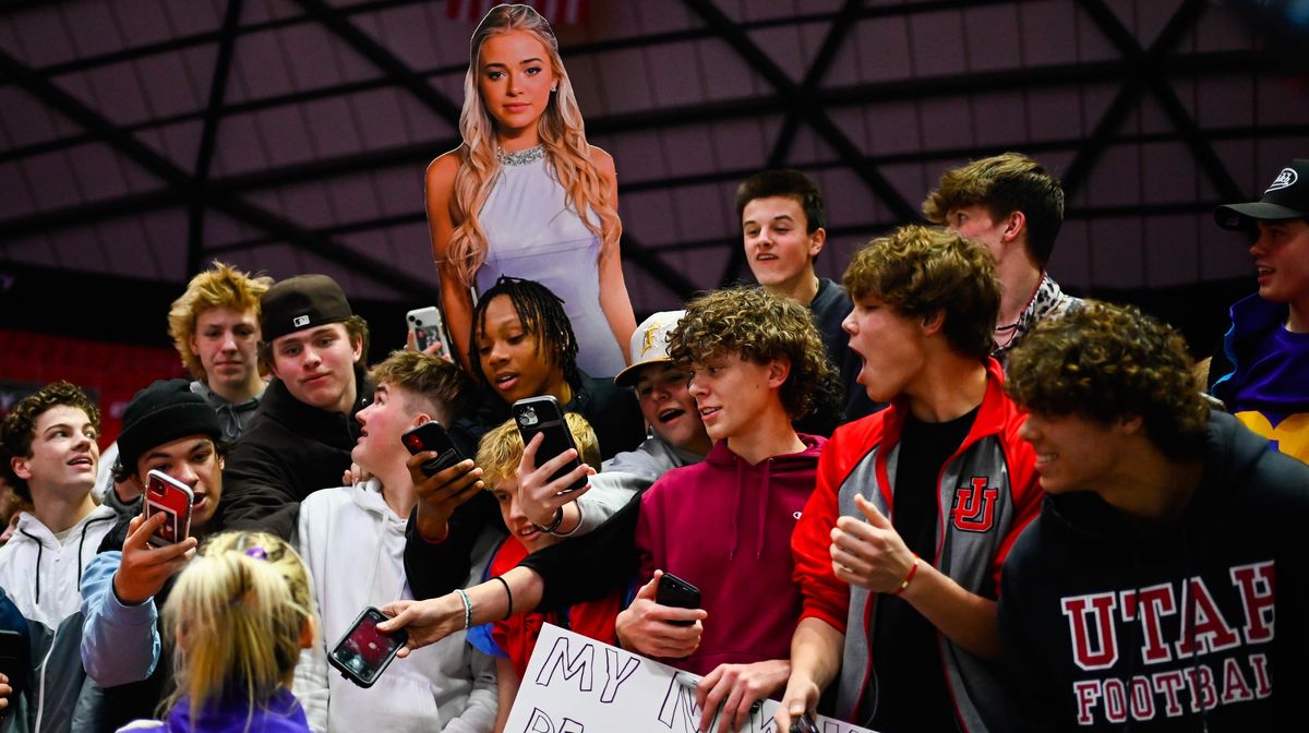 Olivia Dunne of LSU meets with a swarm of male fans after a PAC-12 meet against Utah at Jon M. Huntsman Center on Jan. 6, 2023, in Salt Lake City, Utah