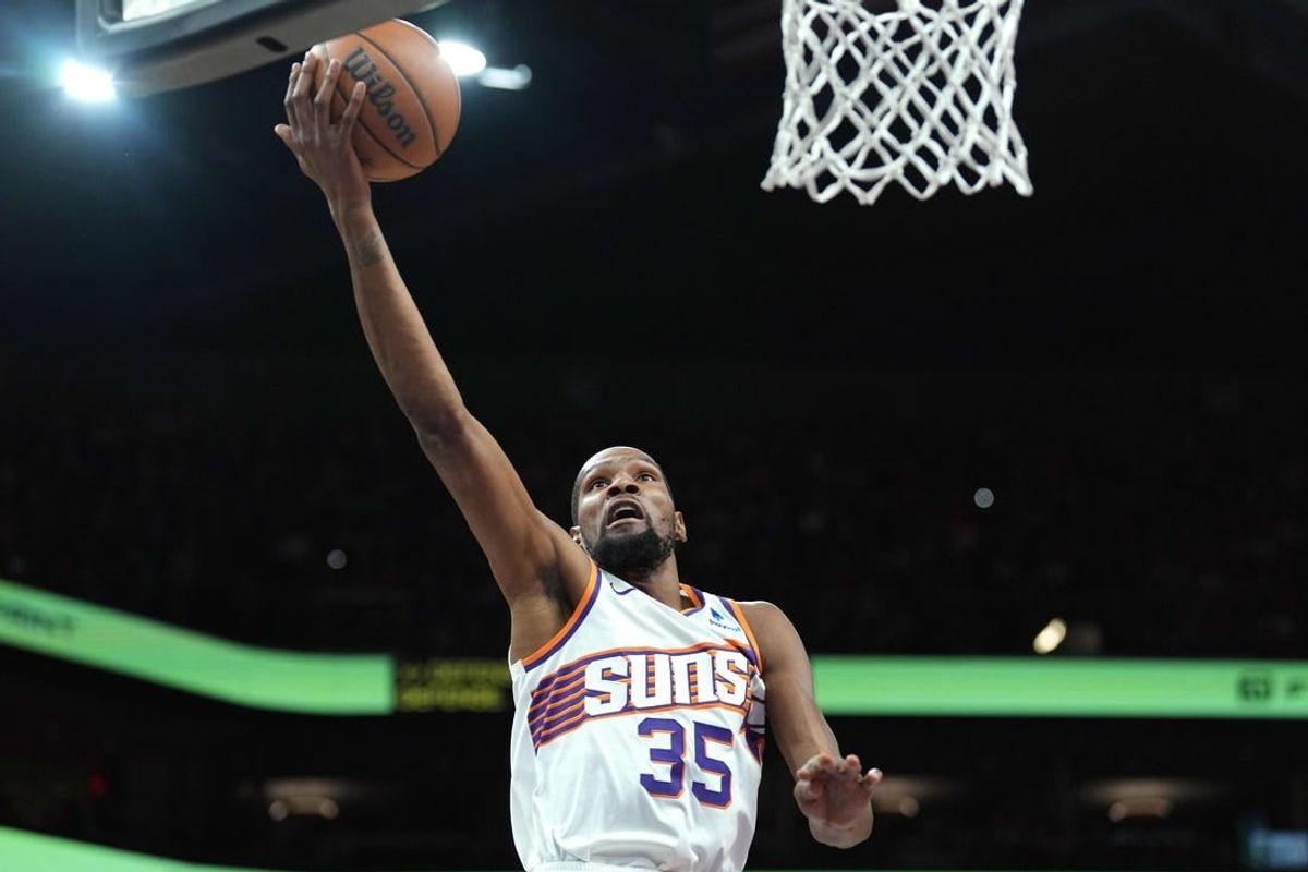 Mar 20, 2024; Phoenix, Arizona, USA; Phoenix Suns forward Kevin Durant (35) makes a layup against the Philadelphia 76ers during the first half at Footprint Center.
