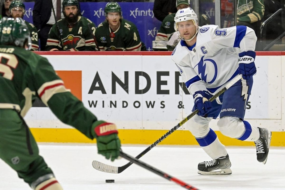 Jan 4, 2024; Saint Paul, Minnesota, USA; Tampa Bay Lightning forward Steven Stamkos (91) controls the puck against the Minnesota Wild during the first period at Xcel Energy Center.