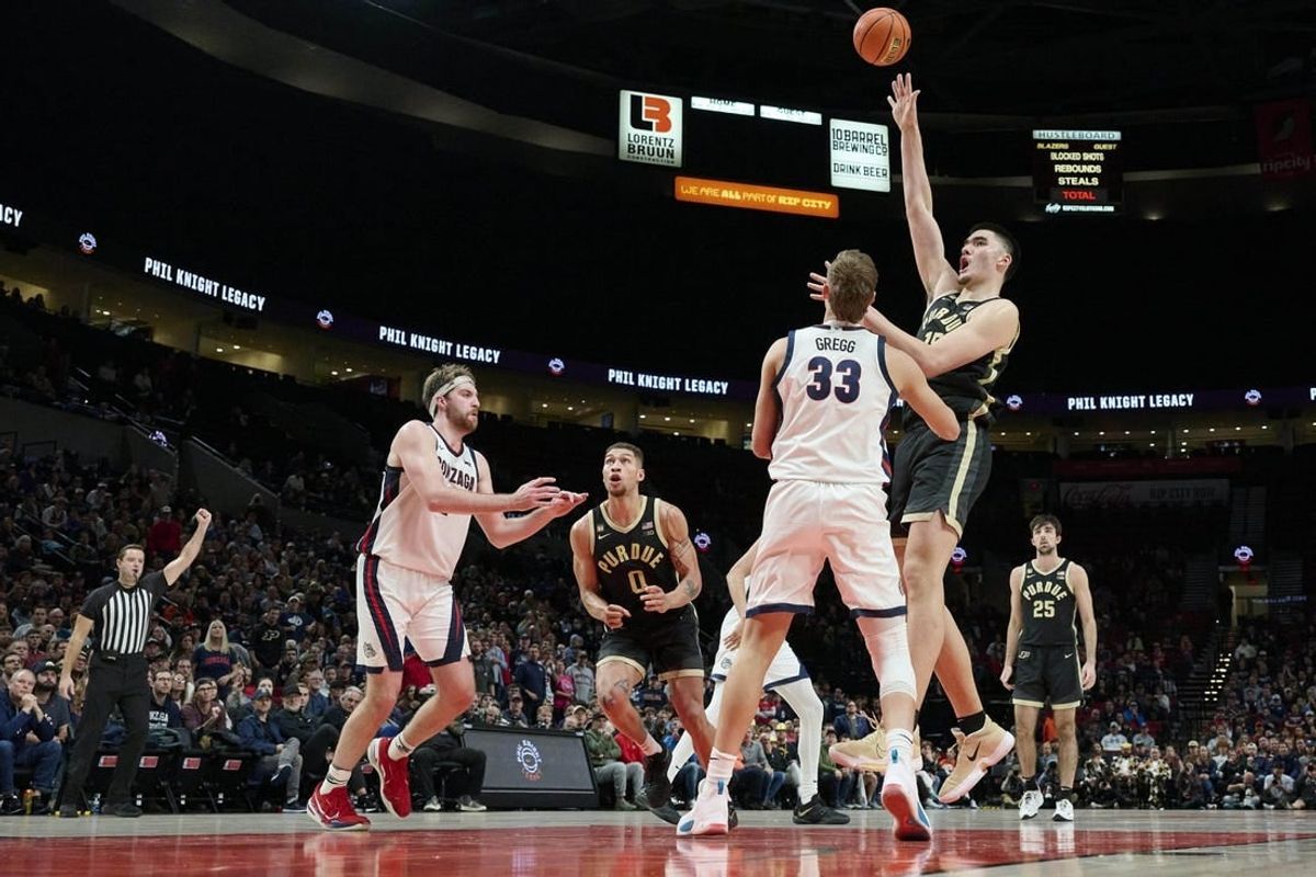 Nov 25, 2022; Portland, Oregon, USA;  Purdue Boilermakers center Zach Edey (15) shoots a basket during the second half against Gonzaga Bulldogs forward Ben Gregg (33) at Moda Center. Purdue won the game 84-66.