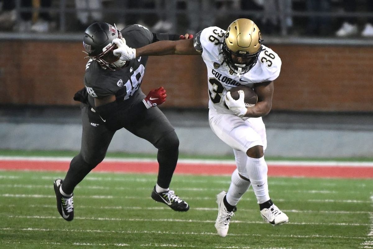 Nov 17, 2023; Pullman, Washington, USA; Colorado Buffaloes running back Sy'veon Wilkerson (36) stiff arms Washington State Cougars linebacker Taariq Al-Uqdah (18) in the first half at Gesa Field at Martin Stadium.