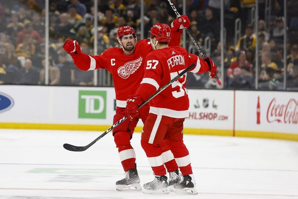 Nov 24, 2023; Boston, Massachusetts, USA; Detroit Red Wings center Dylan Larkin (71) celebrates with left wing David Perron (57) after Peron s goal against the Boston Bruins during the third period at TD Garden.