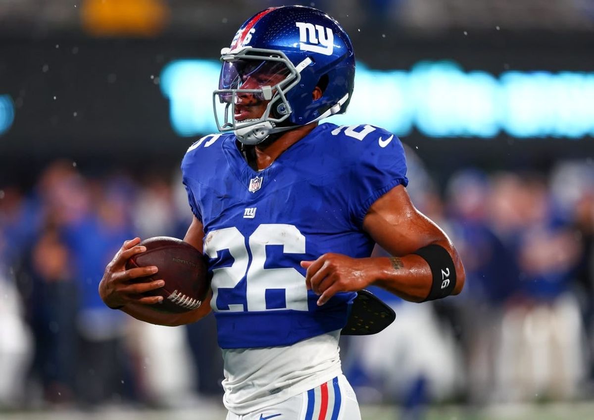 Sep 10, 2023; East Rutherford, New Jersey, USA; New York Giants running back Saquon Barkley (26) runs with the ball during warmups for their game against the Dallas Cowboys at MetLife Stadium.
