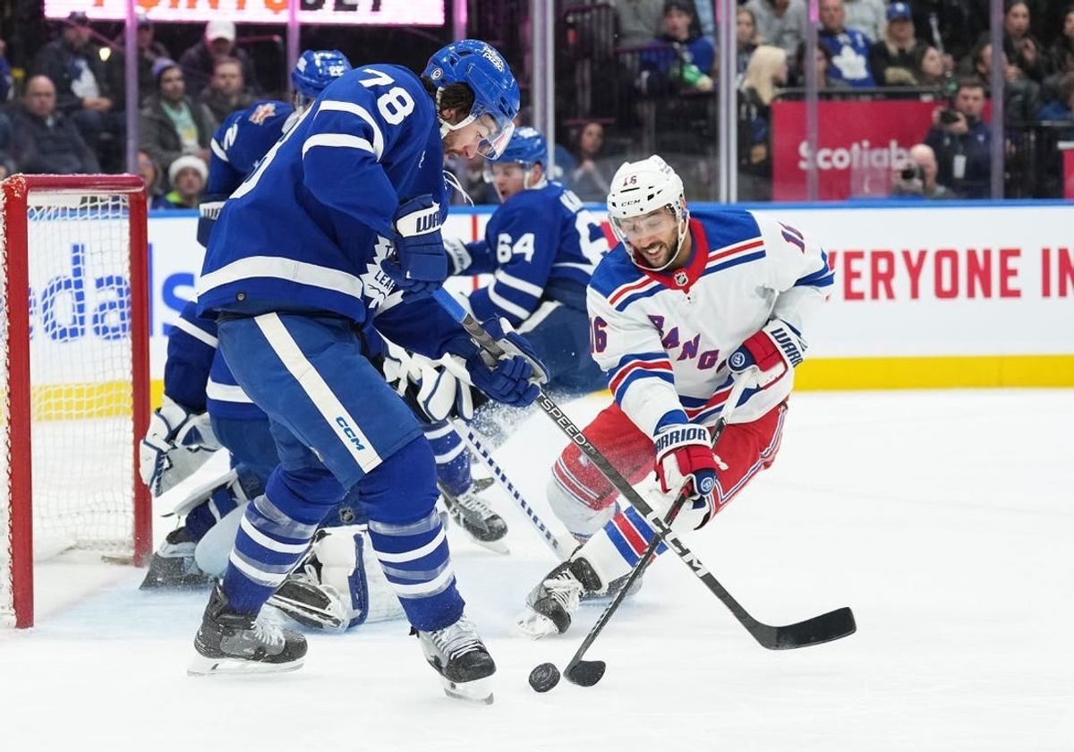 Dec 19, 2023; Toronto, Ontario, CAN; Toronto Maple Leafs defenseman TJ Brodie (78) battles for the puck with New York Rangers center Vincent Trocheck (16) during the second period at Scotiabank Arena.