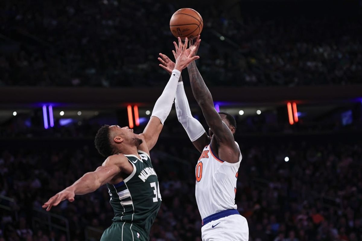 Dec 25, 2023; New York, New York, USA; New York Knicks forward Julius Randle (30) shoots the ball as Milwaukee Bucks forward Giannis Antetokounmpo (34) defends during the first half at Madison Square Garden.