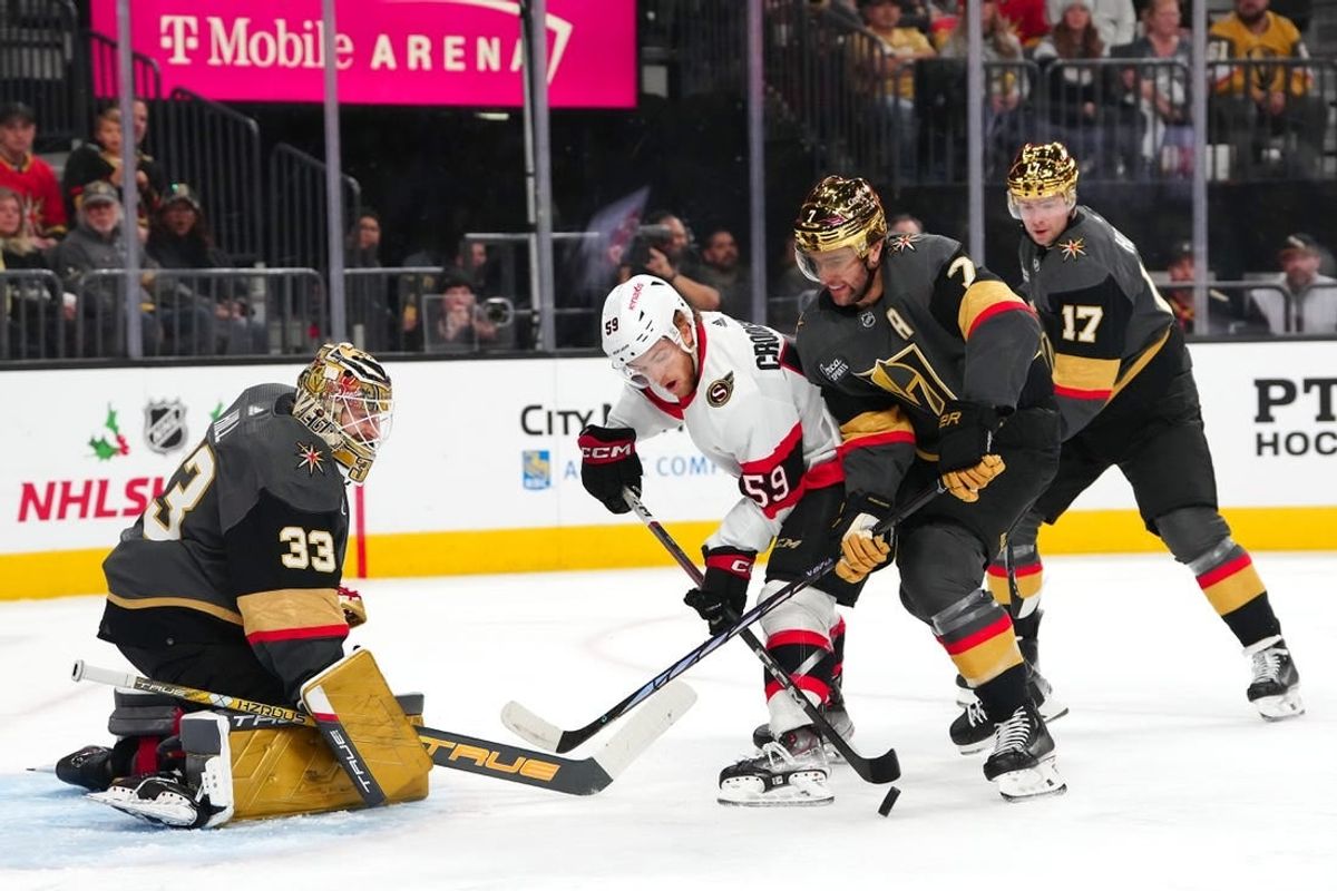 Dec 17, 2023; Las Vegas, Nevada, USA; Ottawa Senators left wing Angus Crookshank (59) attempts to shoot the puck in front of Vegas Golden Knights defenseman Alex Pietrangelo (7) and defenseman Ben Hutton (17) as  goaltender Adin Hill (33) defends his net during the first period at T-Mobile Arena.