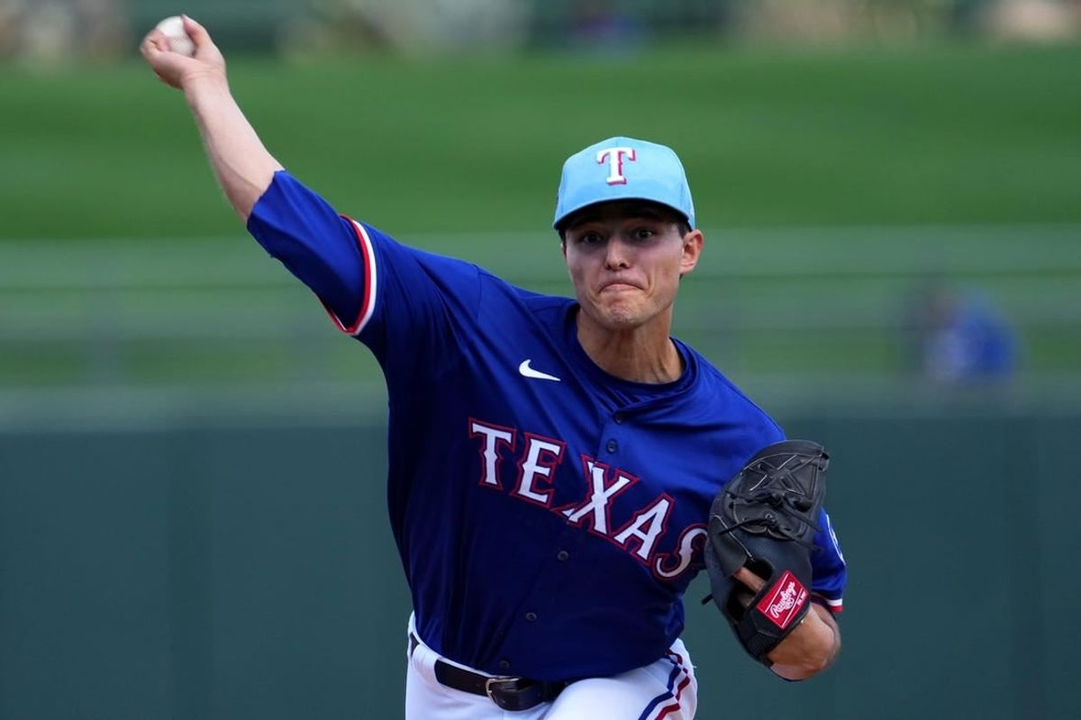 Mar 8, 2024; Surprise, Arizona, USA; Texas Rangers starting pitcher Jack Leiter (71) pitches against the Kansas City Royals during the first inning at Surprise Stadium.