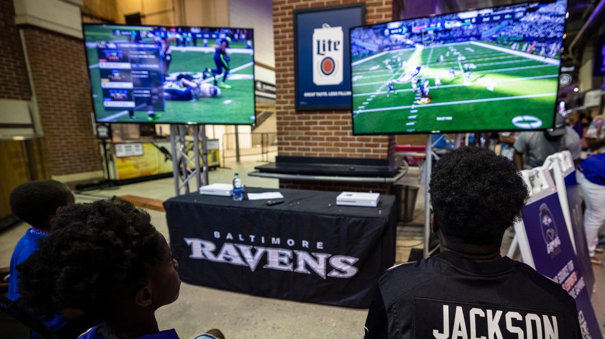 Fans play  Madden  in the concourse during Baltimore Ravens training camp at M&T Bank Stadium on July 31, 2021, in Baltimore.