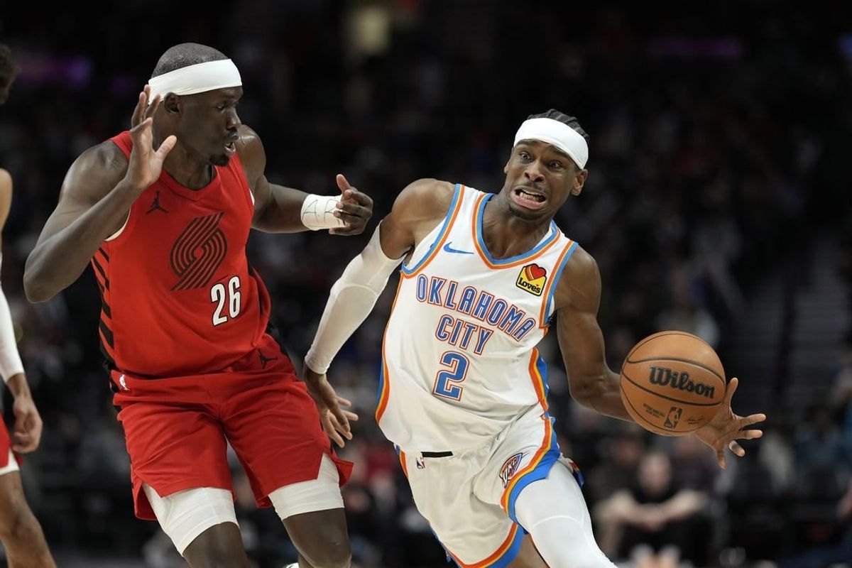 Mar 6, 2024; Portland, Oregon, USA; Oklahoma City Thunder point guard Shai Gilgeous-Alexander (2) is fouled by Portland Trail Blazers center Duop Reath (26) during the second half at Moda Center.