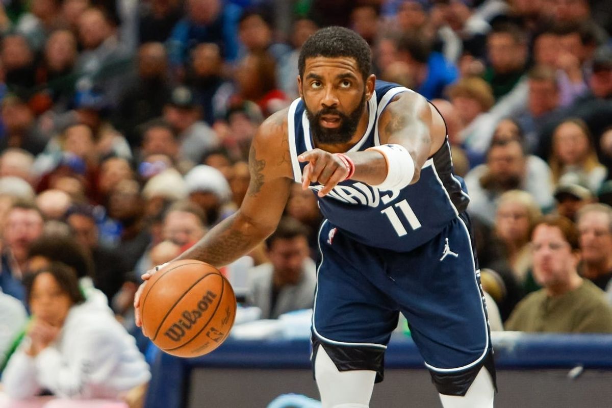 Jan 22, 2024; Dallas, Texas, USA; Dallas Mavericks guard Kyrie Irving (11) points while handling the ball during the fourth quarter against the Boston Celtics at American Airlines Center.