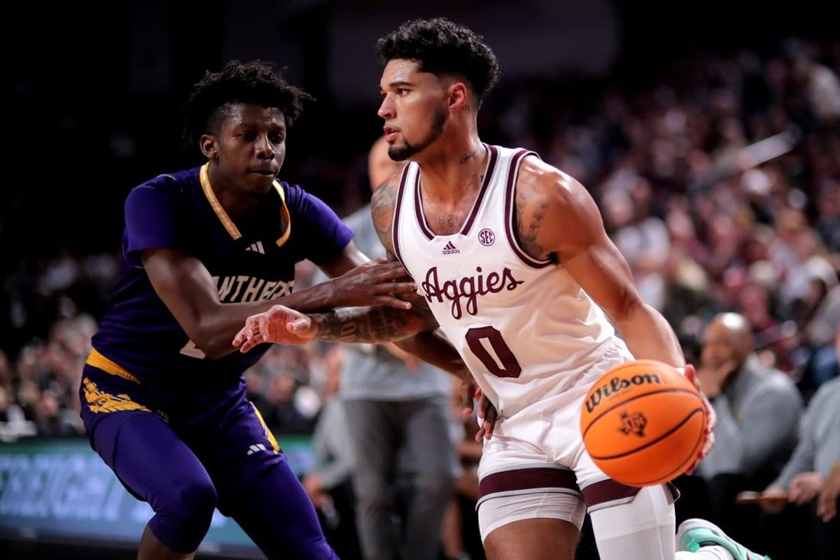 Dec 30, 2023; College Station, Texas, USA; Texas A&M Aggies guard Jace Carter (0) drives to the basket against Prairie View A&M Panthers forward Chris Felix Jr. (25) during the first half at Reed Arena.