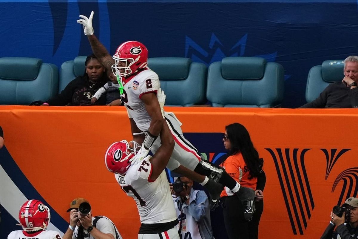 Dec 30, 2023; Miami Gardens, FL, USA; Georgia Bulldogs running back Kendall Milton (2) reacts after scoring a touchdown against the Florida State Seminoles during the first half in the 2023 Orange Bowl at Hard Rock Stadium.