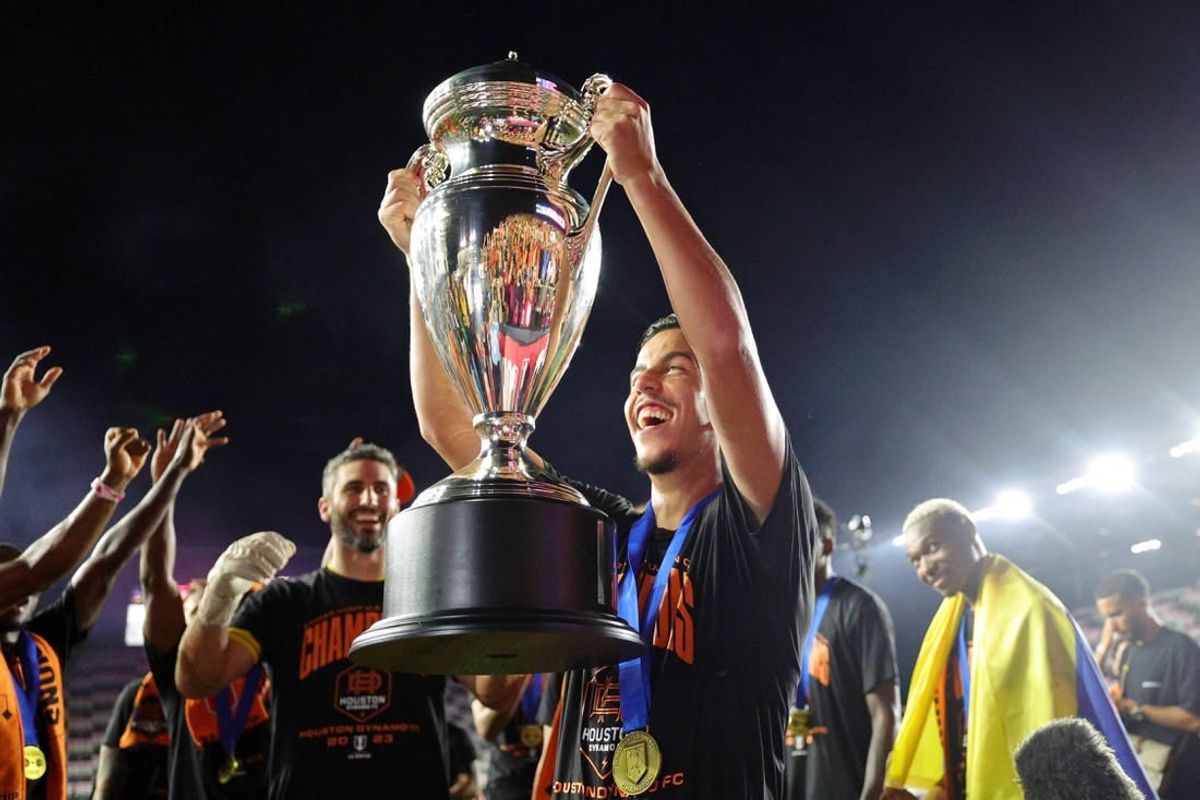 Sep 27, 2023; Fort Lauderdale, FL, USA; Houston Dynamo midfielder Amine Bassi (8) holds up the trophy after winning the Lamar Hunt U.S. Open Cup Final against Inter Miami CF at DRV PNK Stadium.
