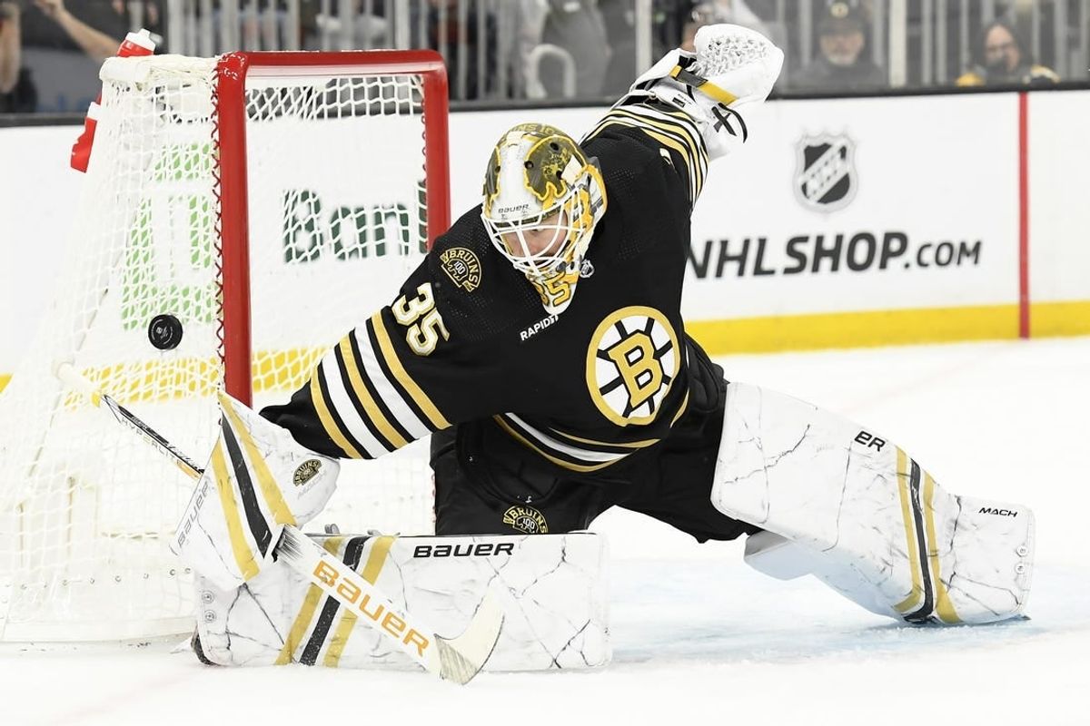 Feb 8, 2024; Boston, Massachusetts, USA; Boston Bruins goaltender Linus Ullmark (35) makes a save during the second period against the Vancouver Canucks at TD Garden.