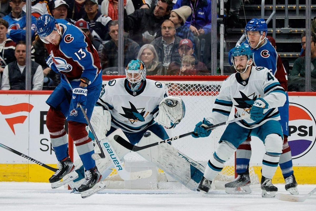 Dec 17, 2023; Denver, Colorado, USA; Colorado Avalanche right wing Valeri Nichushkin (13) screens San Jose Sharks goaltender Mackenzie Blackwood (29) on a shot as defenseman Kyle Burroughs (4) and right wing Mikko Rantanen (96) defend in the first period at Ball Arena.