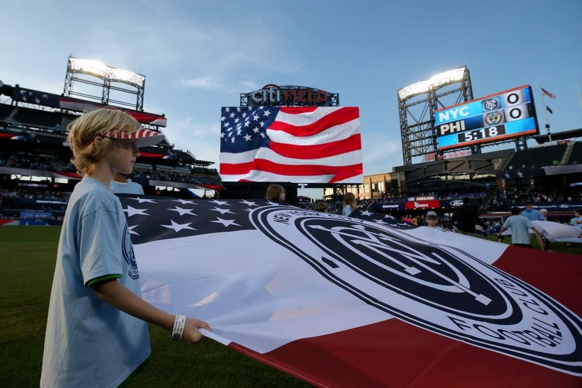 May 27, 2023; Flushing, New York, USA; A young fan holds a banner during the national anthem before a match between New York City FC and the Philadelphia Union at Citi Field.