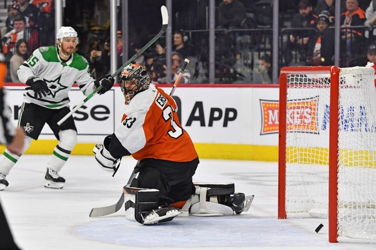 Jan 18, 2024; Philadelphia, Pennsylvania, USA; Philadelphia Flyers goaltender Samuel Ersson (33) looks behind on goal scored by Dallas Stars center Tyler Seguin (91) (not pictured) during the second period at Wells Fargo Center.