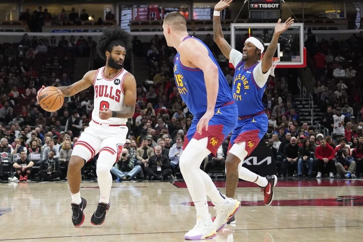 Dec 12, 2023; Chicago, Illinois, USA; Denver Nuggets forward Aaron Gordon (50) defends Chicago Bulls guard Coby White (0) during the first half at United Center.