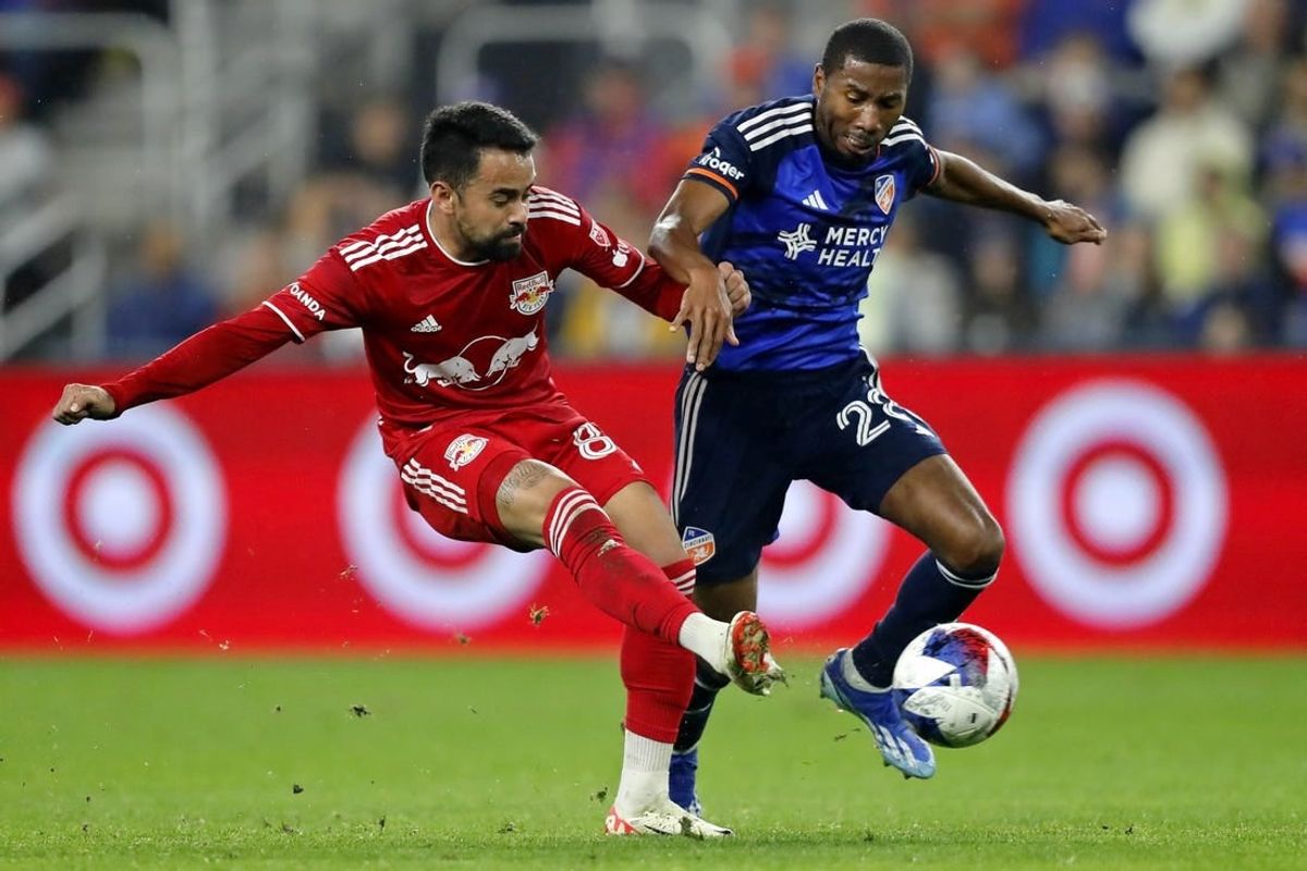 Oct 29, 2023; Cincinnati, OH, USA; New York Red Bulls midfielder Luquinhas (82) battles for the ball against FC Cincinnati defender Ray Gaddis (28) during the first half of game one in a round one match of the 2023 MLS Cup Playoffs at TQL Stadium.