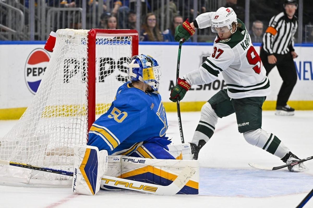 Mar 16, 2024; St. Louis, Missouri, USA;  Minnesota Wild left wing Kirill Kaprizov (97) shoots and scores the game tying goal against St. Louis Blues goaltender Jordan Binnington (50) during the third period at Enterprise Center.