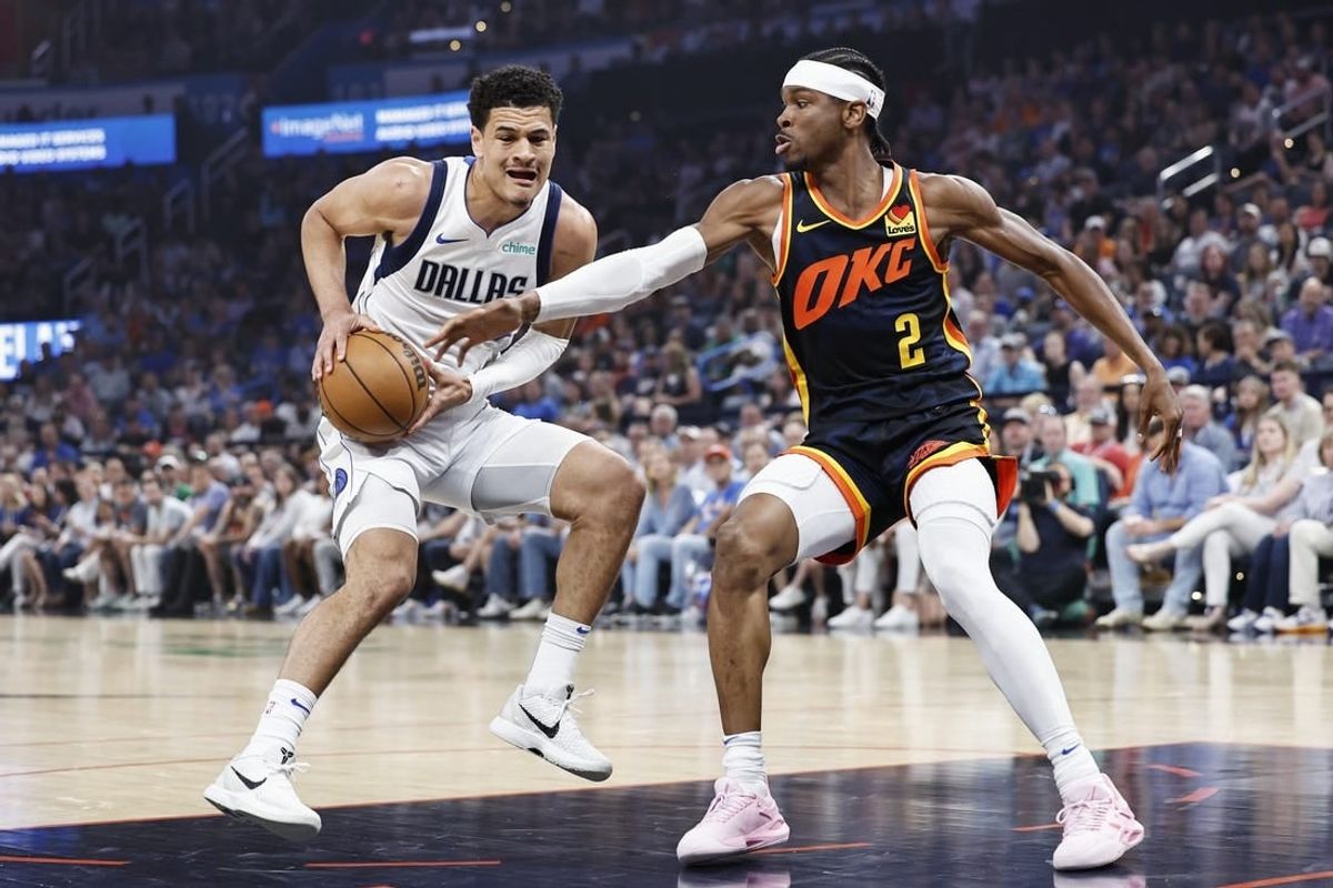 Apr 14, 2024; Oklahoma City, Oklahoma, USA; Dallas Mavericks guard Josh Green (8) is defended by Oklahoma City Thunder guard Shai Gilgeous-Alexander (2) on a drive to the basket during the first quarter at Paycom Center.