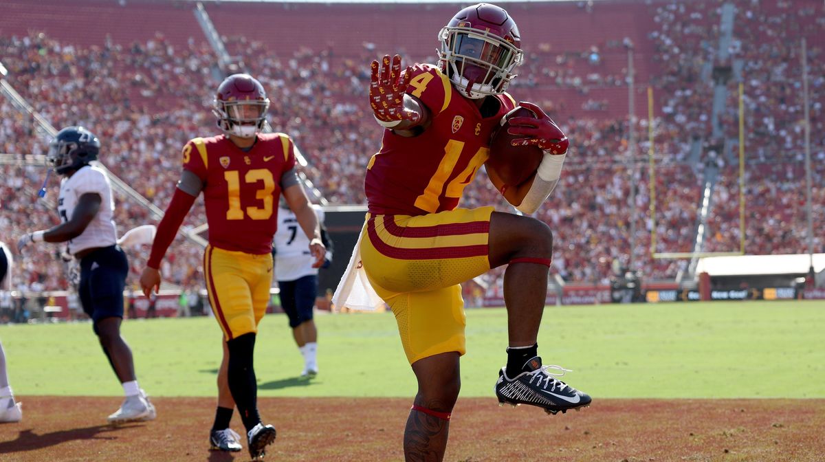 USC’s Raleek Brown celebrates his touchdown in front of Caleb Williams in the Trojans’ 66-14 win over the Rice Owls.