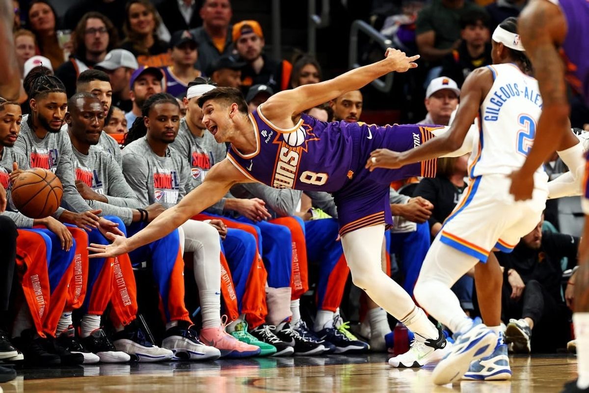 Mar 3, 2024; Phoenix, Arizona, USA; Phoenix Suns guard Grayson Allen (8) tries to save the ball from going out of bounds against Oklahoma City Thunder guard Shai Gilgeous-Alexander (2) during the first quarter at Footprint Center.