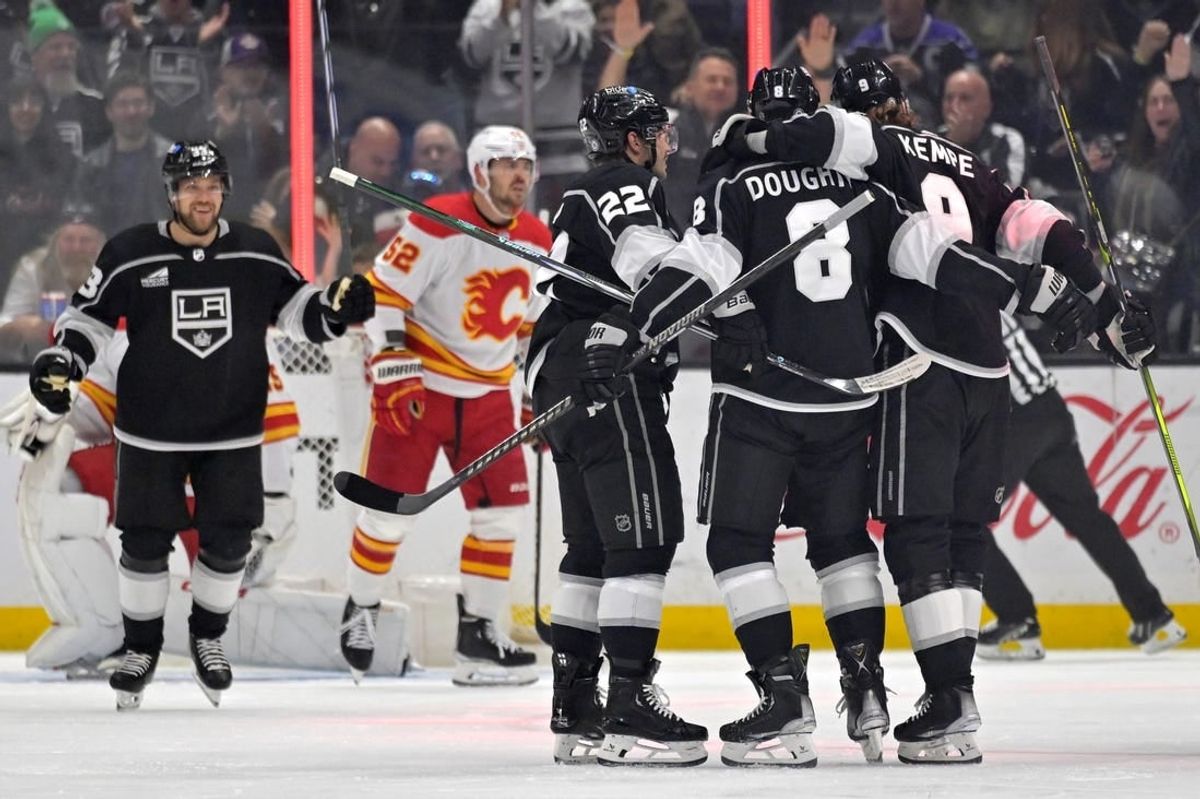 Apr 11, 2024; Los Angeles, California, USA;   Los Angeles Kings celebrate after a goal by left wing Kevin Fiala (22) in the first period against the Calgary Flames at Crypto.com Arena.
