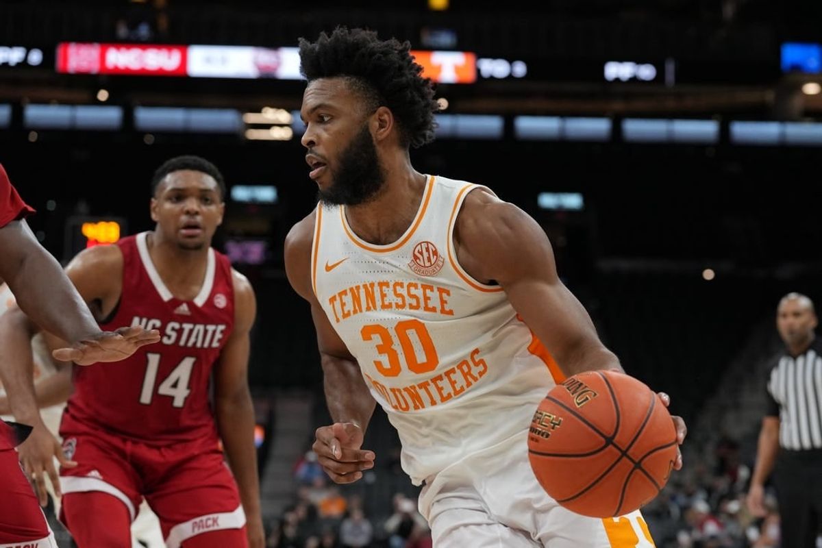 Dec 16, 2023; San Antonio, Texas, USA;  Tennessee Volunteers guard Josiah-Jordan James (30) dribbles in the second half against the North Carolina State Wolfpack at the Frost Bank Center.