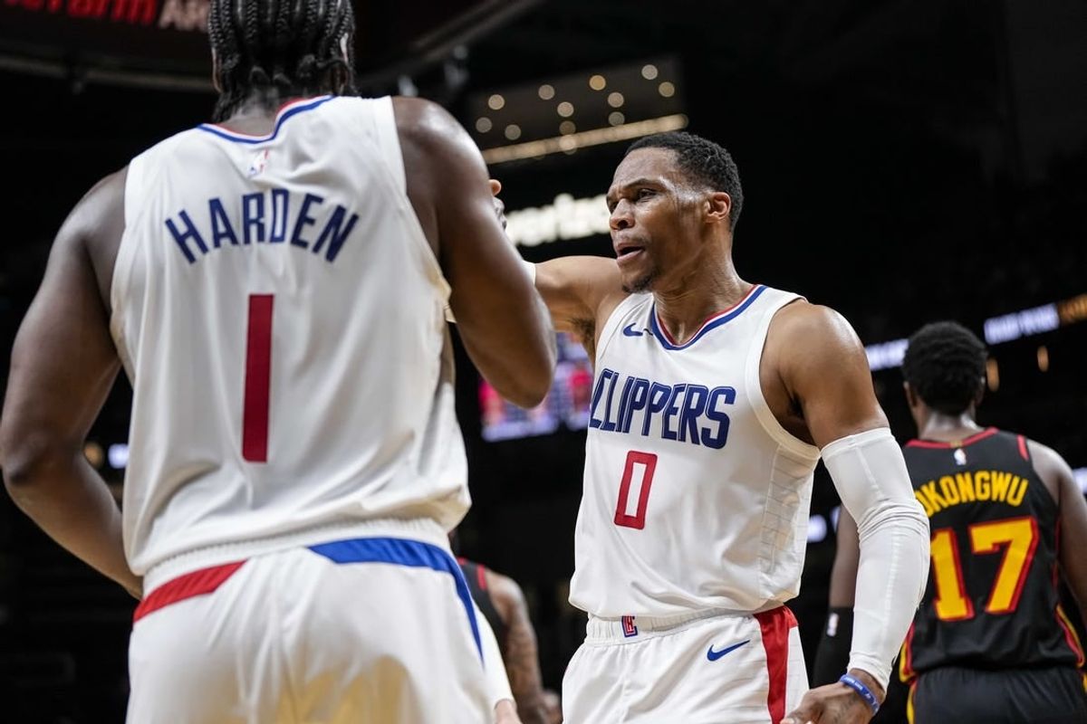 Feb 5, 2024; Atlanta, Georgia, USA; LA Clippers guard Russell Westbrook (0) reacts with guard James Harden (1) against the Atlanta Hawks during the second half at State Farm Arena.