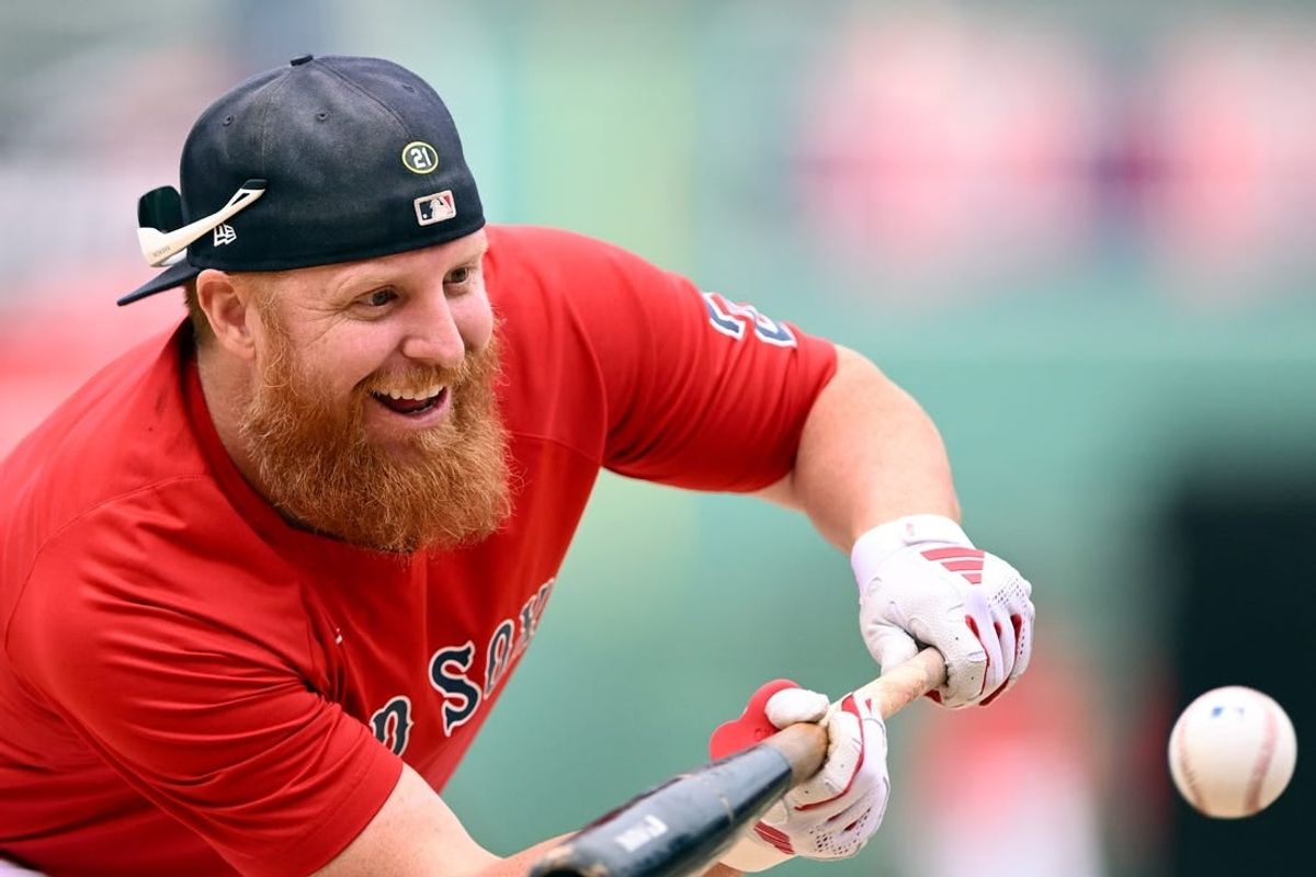 Sep 8, 2023; Boston, Massachusetts, USA; Boston Red Sox designated hitter Justin Turner (2) bunts during batting practice before a game against the Baltimore Orioles at Fenway Park.