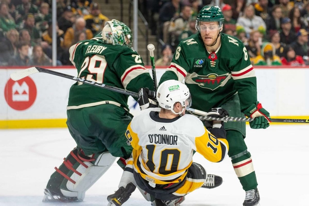 Feb 9, 2024; Saint Paul, Minnesota, USA; Minnesota Wild defenseman Dakota Mermis (6) is called for a penalty on Pittsburgh Penguins left wing Drew O'Connor (10) in the first period at Xcel Energy Center.