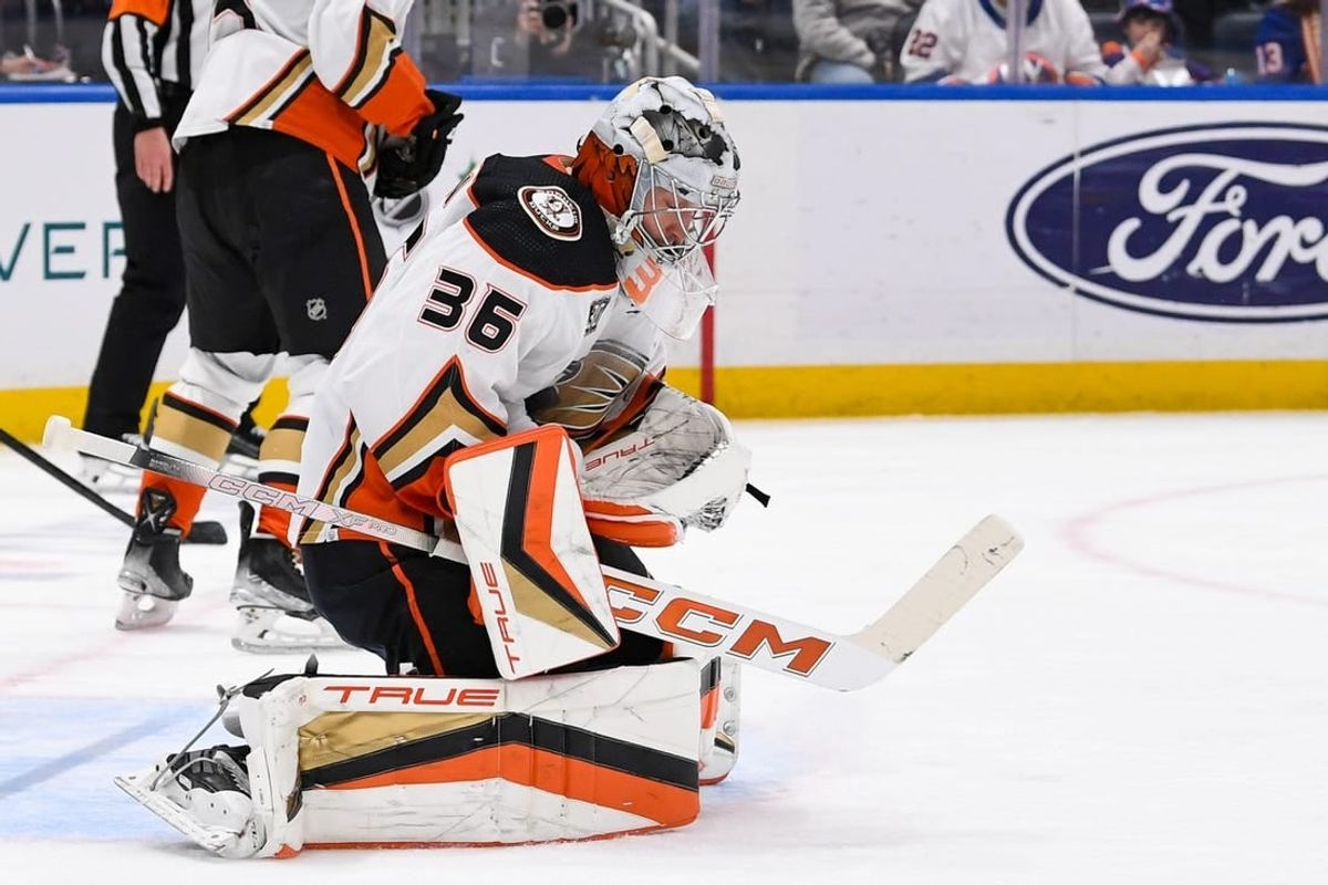 Dec 13, 2023; Elmont, New York, USA; Anaheim Ducks goaltender John Gibson (36) makes a save against the New York Islanders during the second period at UBS Arena.