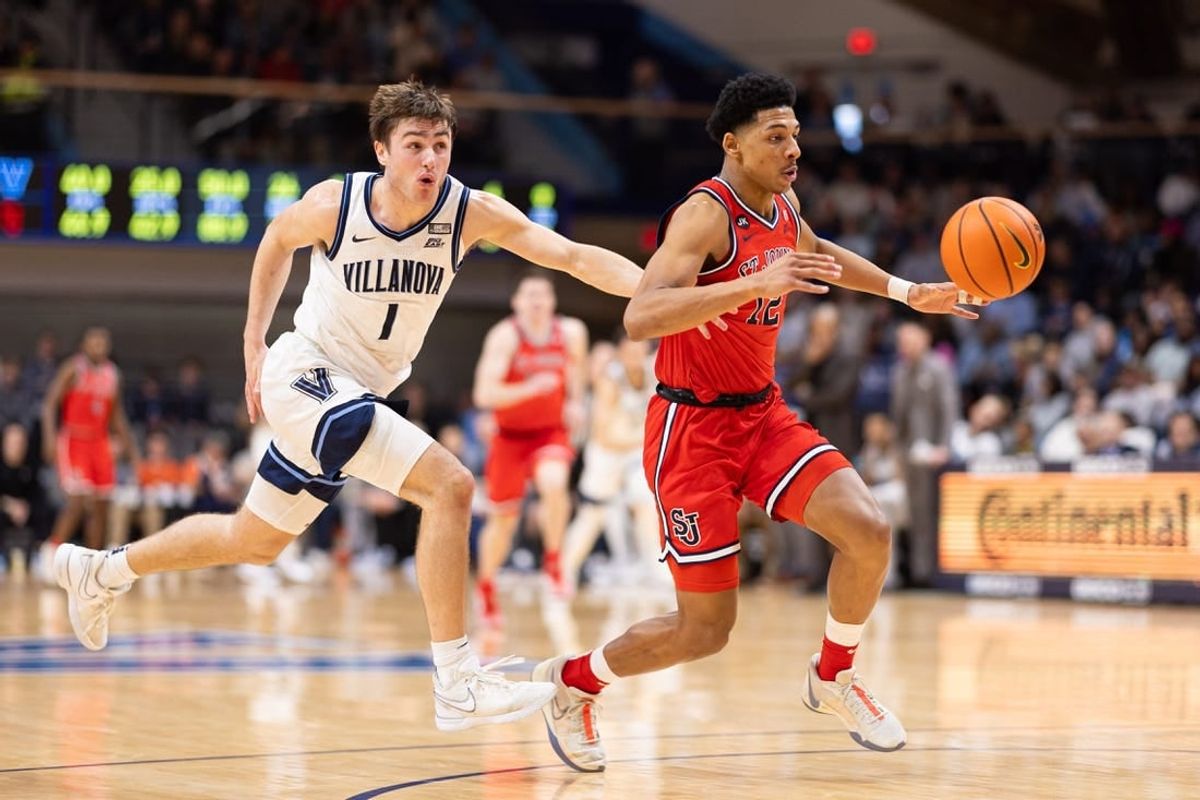 Jan 6, 2024; Villanova, Pennsylvania, USA; St. John's Red Storm guard RJ Luis Jr. (12) picks up the loose ball past Villanova Wildcats guard Brendan Hausen (1) during the second half at William B. Finneran Pavilion.