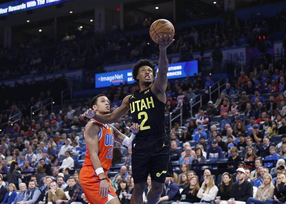 Dec 11, 2023; Oklahoma City, Oklahoma, USA; Utah Jazz guard Collin Sexton (2) shoots in front of Oklahoma City Thunder guard Tre Mann (23) during the second half at Paycom Center.