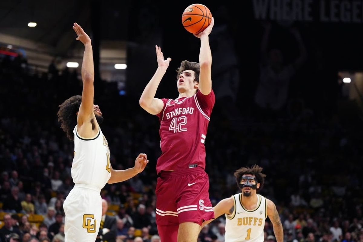 Mar 3, 2024; Boulder, Colorado, USA; Stanford Cardinal forward Maxime Raynaud (42) shoots over Colorado Buffaloes guard Javon Ruffin (11) in the first half at the CU Events Center.