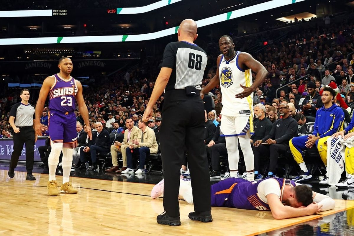 Dec 12, 2023; Phoenix, Arizona, USA; Golden State Warriors forward Draymond Green (23) reacts after being called for a foul on Phoenix Suns center Jusuf Nurkic (20) during the third quarter at Footprint Center.