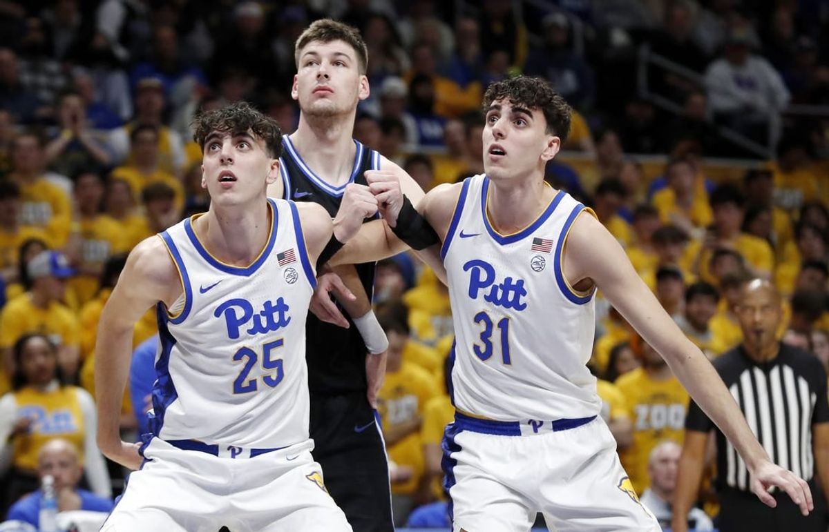 Jan 9, 2024; Pittsburgh, Pennsylvania, USA;  Pittsburgh Panthers twin forwards Guillermo Diaz Graham (25) and Jorge Diaz Graham (31) box out Duke Blue Devils center Kyle Filipowski (middle) during the first half at the Petersen Events Center.