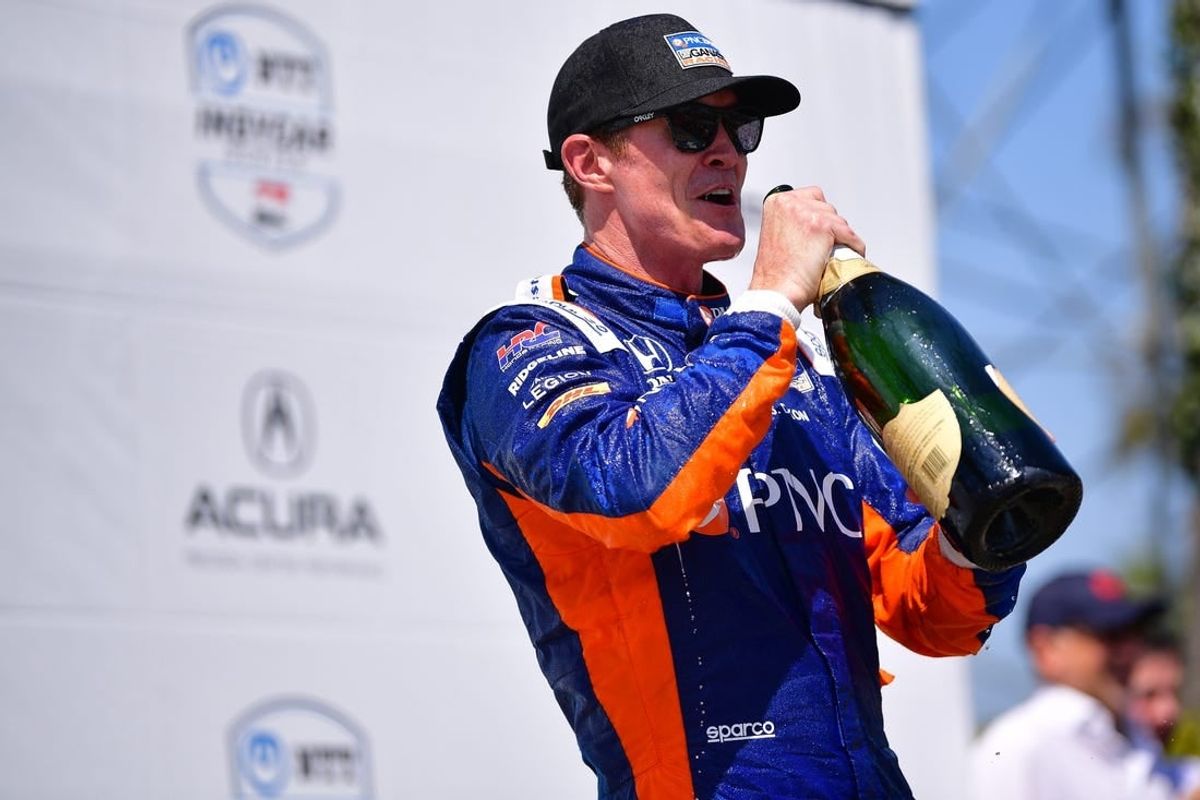 Apr 21, 2024; Long Beach, California, USA; Chip Ganassi Racing driver Scott Dixon (9) of New Zealand celebrates his victory of the Long Beach Grand Prix.