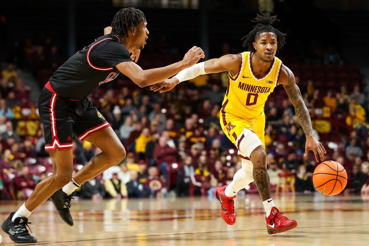 Dec 12, 2023; Minneapolis, Minnesota, USA; Minnesota Golden Gophers guard Elijah Hawkins (0) works around IUPUI Jaguars guard Kidtrell Blocker (8) during the first half at Williams Arena.